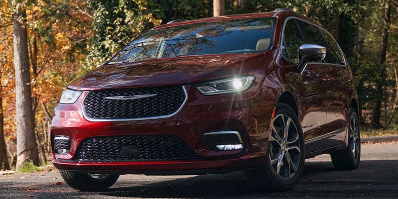 Red Chrysler Pacifica driving in Dansville, NY