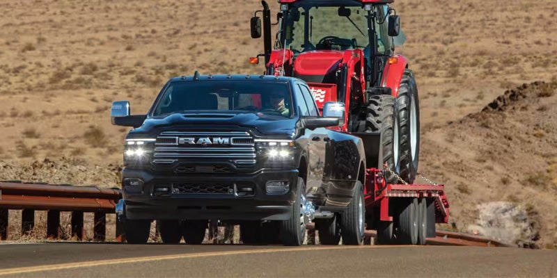 RAM 3500 driving with tractor in Dansville, NY